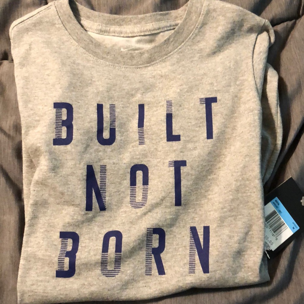 2 NWT Dri fit Nike short sleeve shirts. Brand new.